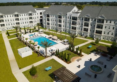 Aerial view of landscaped outdoor space with pool