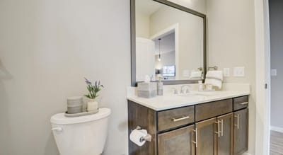 Well-lit bathroom with modern fixtures and decor