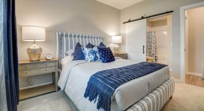 Well-decorated resident bedroom in a senior living facility
