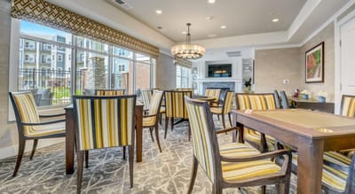 Bright common area with dining chairs and tables