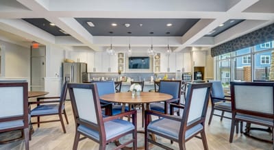 Bright dining area with wooden tables and chairs