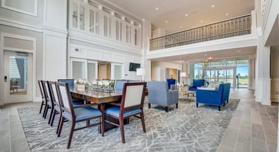 Interior view of a spacious common area with seating and tables