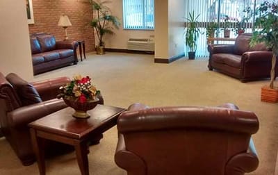 Comfortable common area with seating and plants