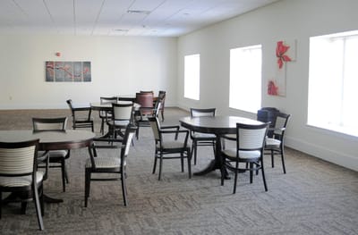 Bright common area with tables and chairs