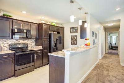 A well-lit kitchen area in a senior living facility
