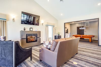 Cozy common area with seating and fireplace