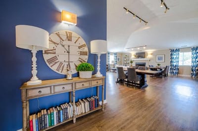 Bright common area with a dining setup and decor