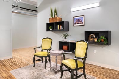 Bright interior common area with chairs and decor