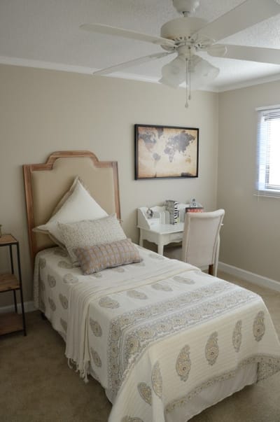 Cozy private resident room with a bed and desk