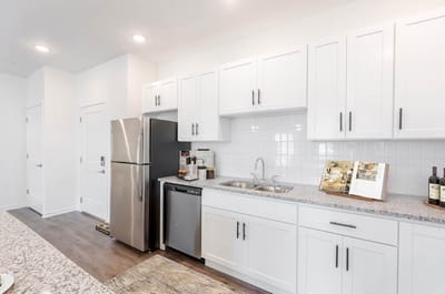 Modern kitchen area with appliances and decor