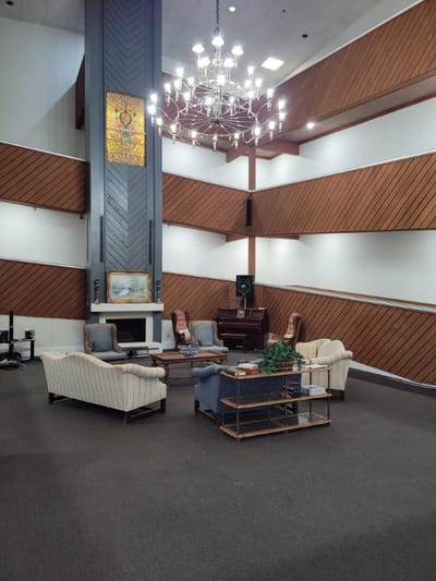 Interior common area with seating and chandelier