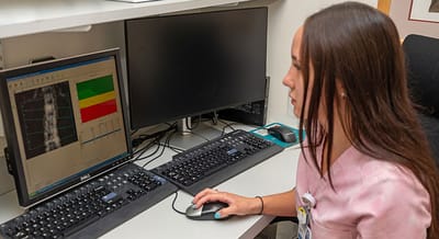 Mount Sinai South Nassau, Nursing Home in Oceanside, NY — Person analyzing data on computer monitors in an office
