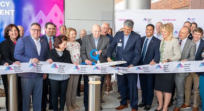 Ribbon-cutting ceremony with staff and residents