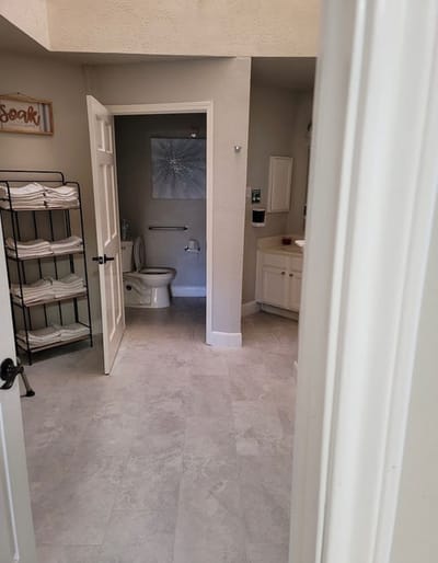 Clean bathroom with towels and decor