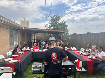 Residents enjoying an outdoor meal together.