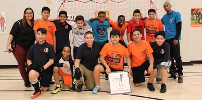 Group of children in a sports setting.