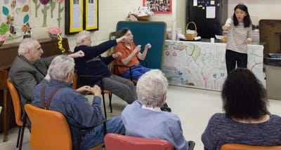Residents and staff engaged in a lively activity session.