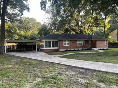 Exterior view of a single-story assisted living facility.