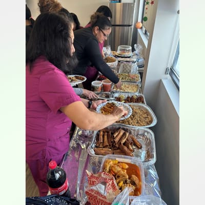 Staff preparing and serving various dishes of food.