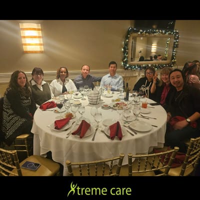 Group of people enjoying a meal at a dining table.