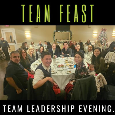 Team dinner with residents and staff gathered together.