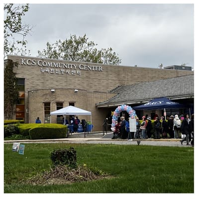 Exterior view of community center with people