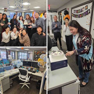 Staff celebrating with a cake in an office
