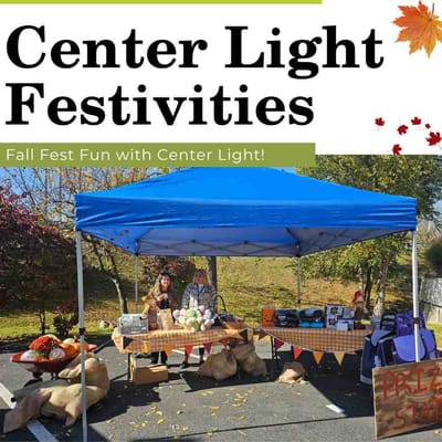 Outdoor festival tent with vendors and decorations.