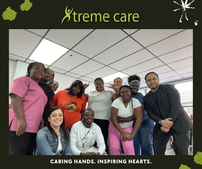 Staff members posing together in a common area.