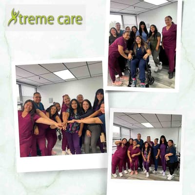 Staff members posing together in a common area