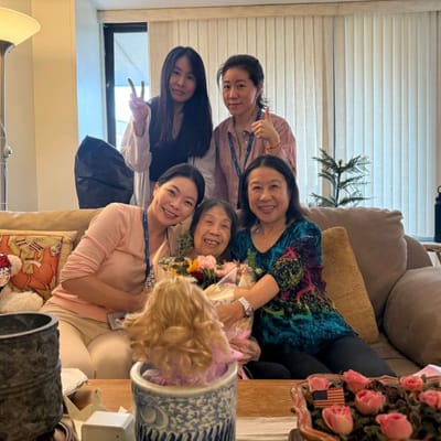 Candid moment with staff and residents in a cozy common area.