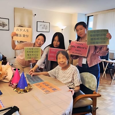 Residents and staff celebrating a birthday party