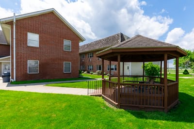 Outdoor gazebo and building exterior at PAZ Health Care.