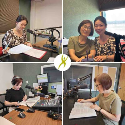 Residents and staff engaged in an activity in a studio