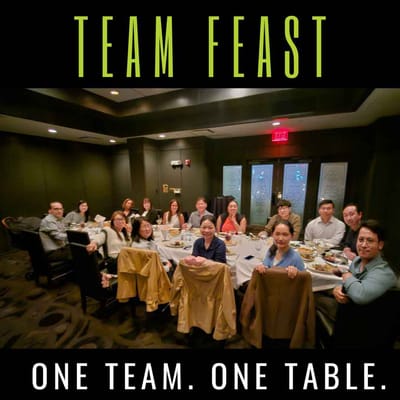 Staff members enjoying a team meal together.