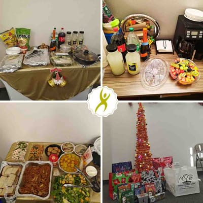 Table set with various meals and drinks for a gathering.