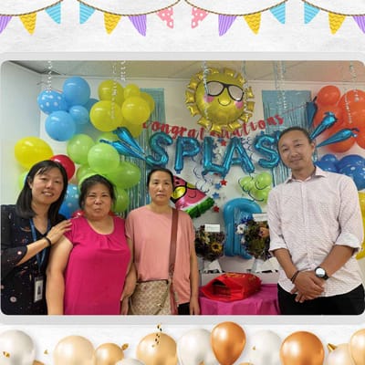 Residents and staff celebrating with colorful decorations.