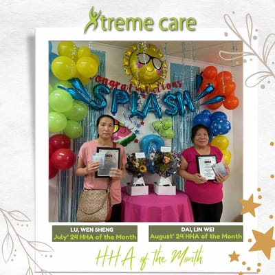 Staff members celebrating HHA of the Month awards.
