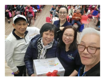 Residents and staff celebrating in a common area.