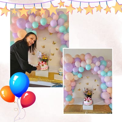 Celebratory cake with balloon decorations