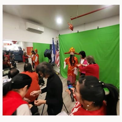 Residents and staff celebrating an event indoors.