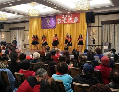 Residents enjoying a performance at the facility event.