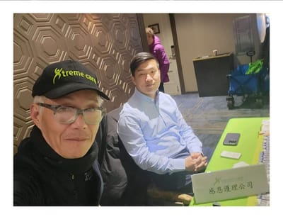 Two staff members at a table inside the facility.