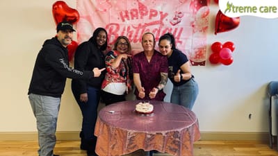 Celebration with residents and staff at a birthday party.