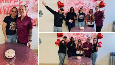 Residents celebrating a birthday with a cake and decorations.