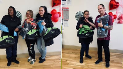 Residents and staff posing with gift bags.