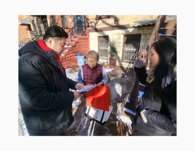 Residents and staff engaged outdoors in winter.