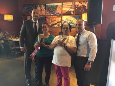 Celebration with staff and residents at an event.