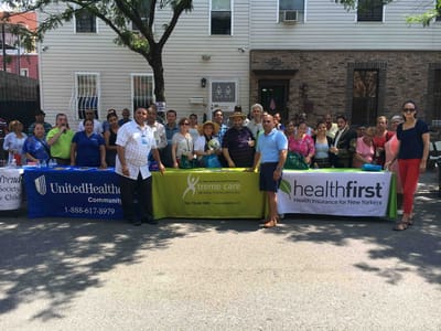 Group event with community members and staff outdoors.