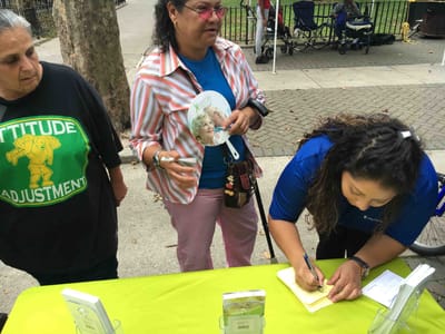 Residents engaging in a community activity outdoors.